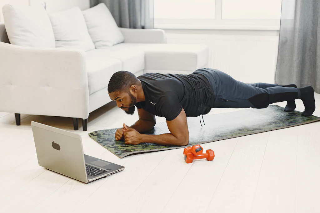 Man doing HIIT workout at home